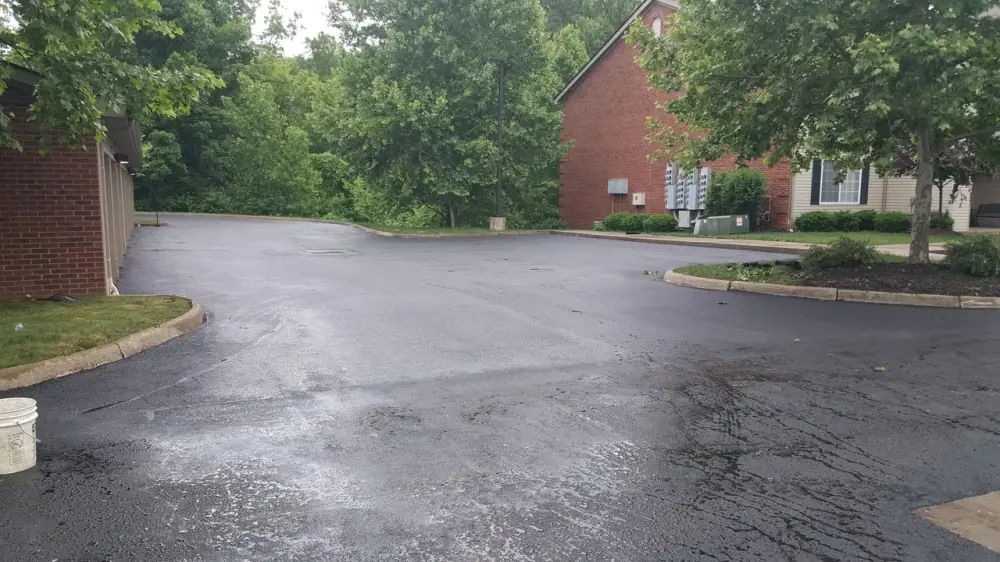 Freshly paved asphalt drive at a residential community