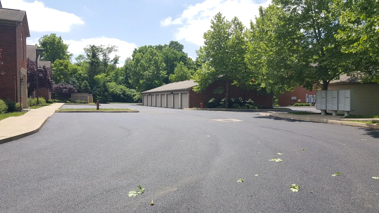 Finished asphalt drive and parking at an apartment community