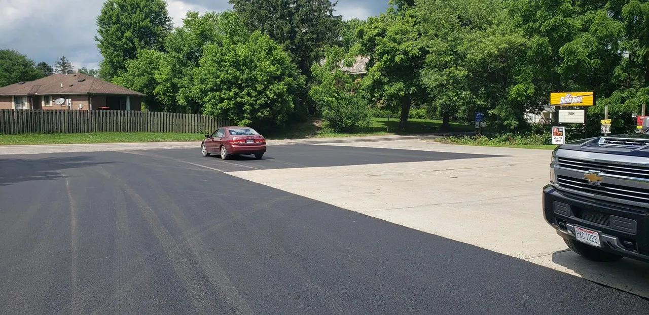 Finished asphalt lot at a drive-thru business